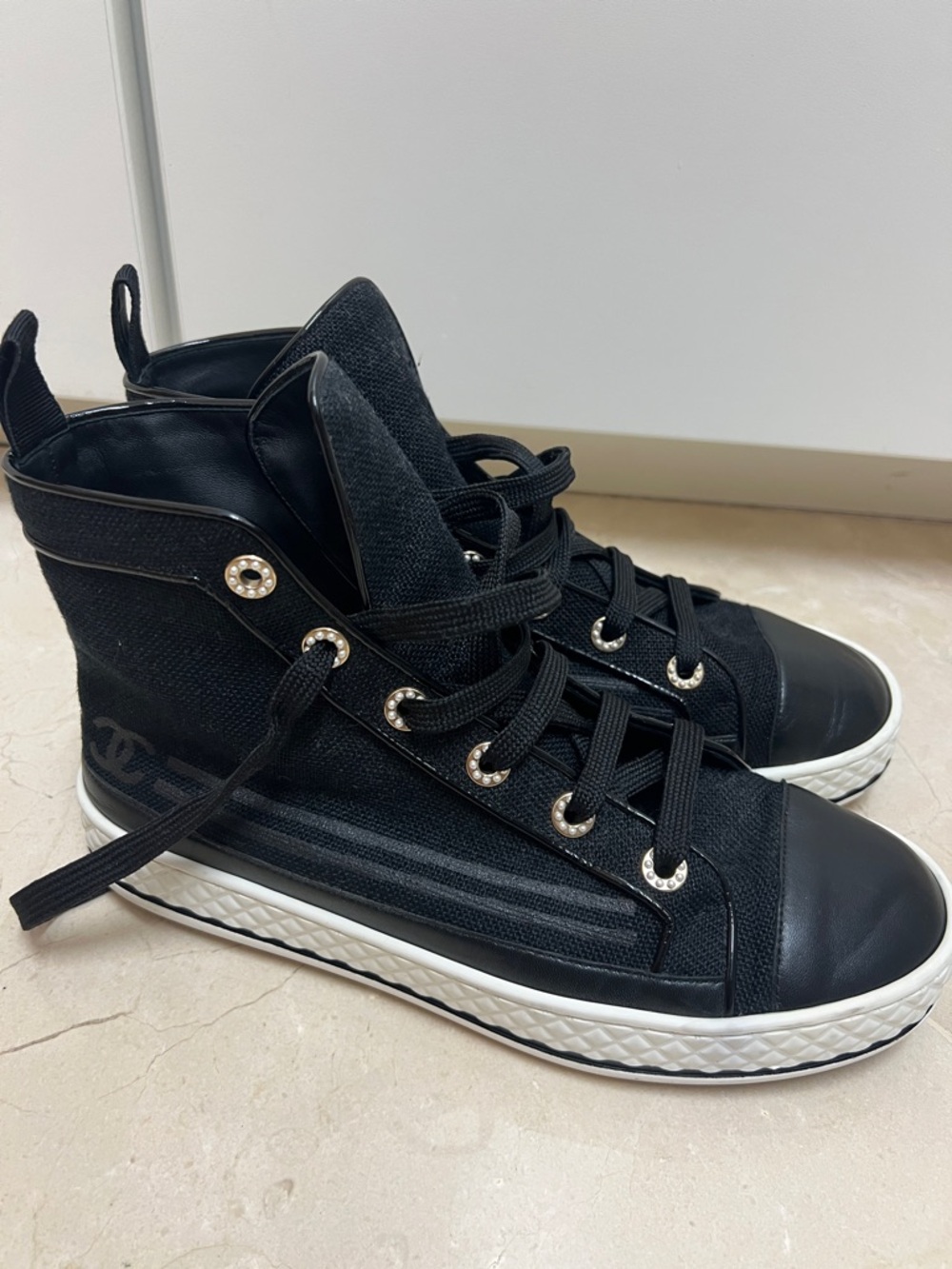 CHANEL Black High-Top Lace-Up Sneakers with White Sole and pearl elements